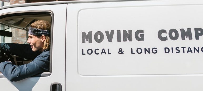 A guy driving a moving truck