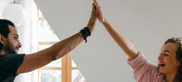 a couple high fiving each other