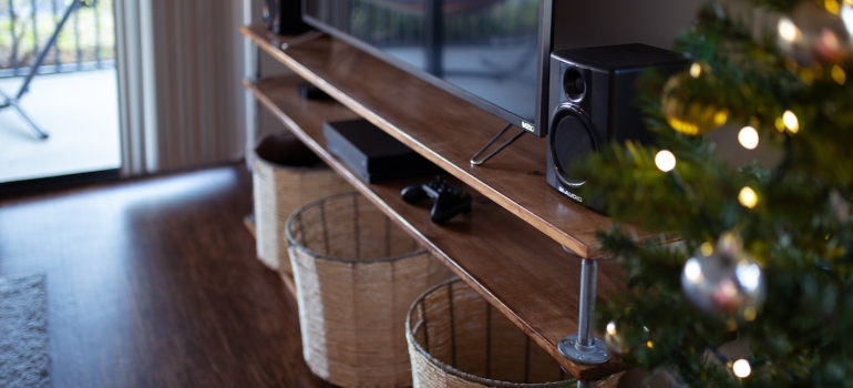 Picture of a TV next to a Christmas tree before packing a flat screen TV for your GTA relocation