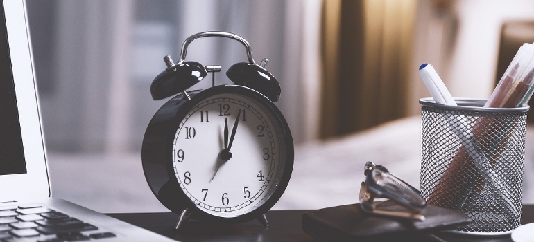 The alarm clock on the desk
