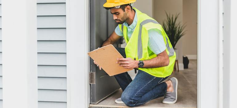 Man checking outside the home.
